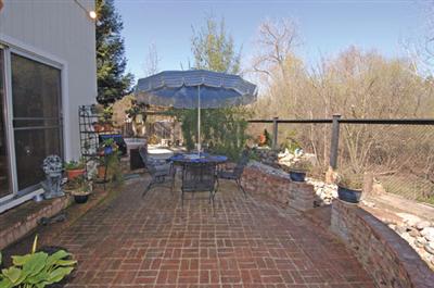 16 Hop Ranch Court Santa Rosa, CA 95403 - Photo 11 of 12 a view of a patio with table and chairs under an umbrella
