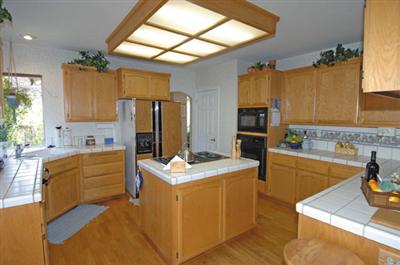 16 Hop Ranch Court Santa Rosa, CA 95403 - Photo 6 of 12 a kitchen that has a sink cabinets stainless steel appliances and a window