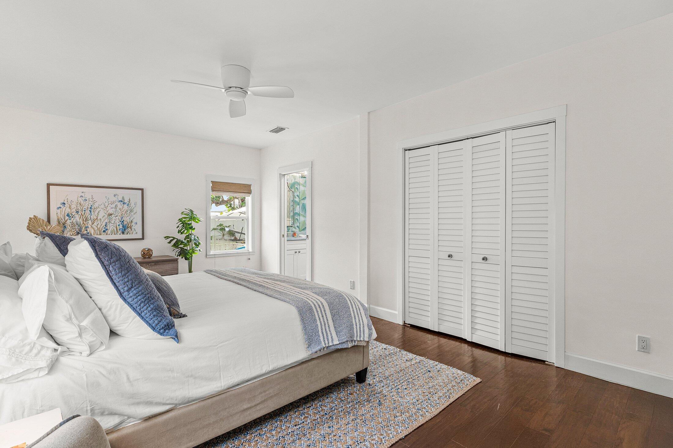 414 Northeast 7th Avenue Delray Beach, FL 33483 - Photo 13 of 29 a bedroom with a bed and a window