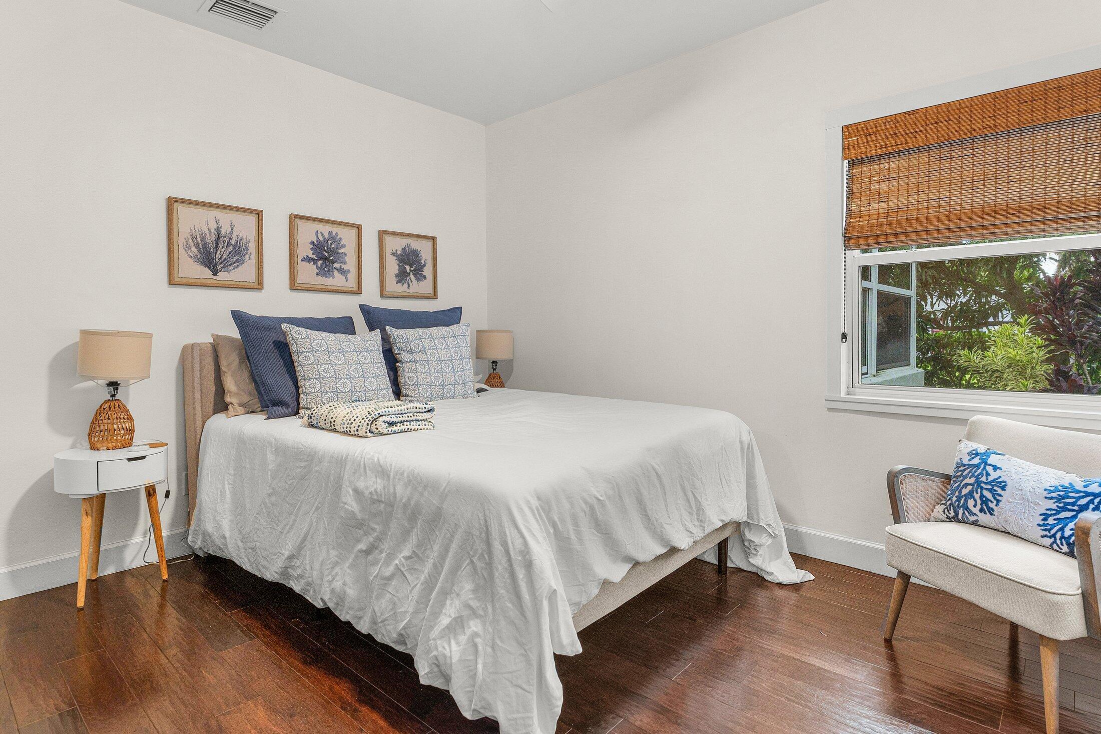 414 Northeast 7th Avenue Delray Beach, FL 33483 - Photo 18 of 29 a bedroom with a bed and a window