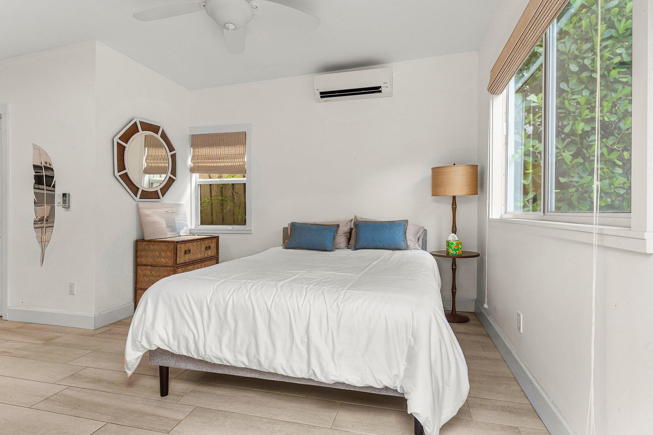 414 Northeast 7th Avenue Delray Beach, FL 33483 - Photo 26 of 29 a bedroom with a bed and a table lamp