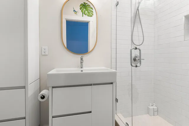 a view of a house with potted plants