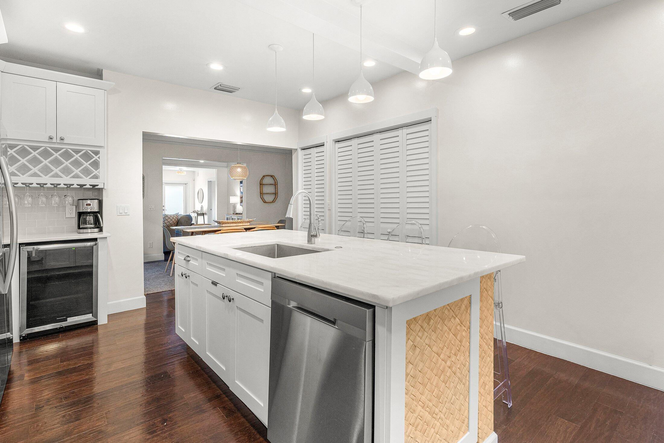 414 Northeast 7th Avenue Delray Beach, FL 33483 - Photo 5 of 29 a kitchen with a sink cabinets and wooden floor