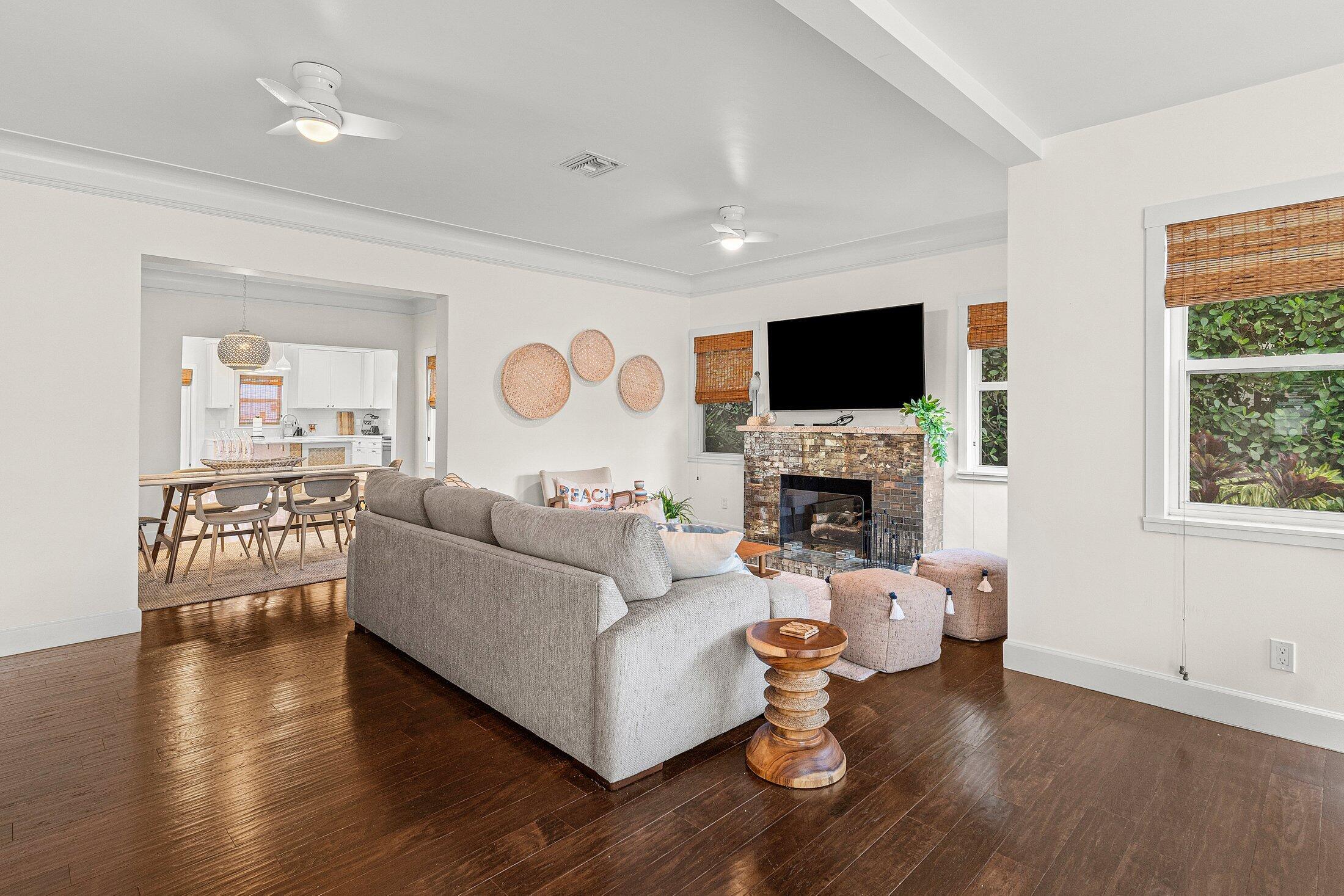 414 Northeast 7th Avenue Delray Beach, FL 33483 - Photo 6 of 29 a living room with furniture a fireplace and a flat screen tv