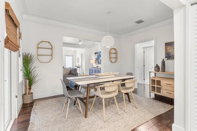a dining room with a table and chairs