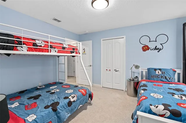a bathroom with a granite countertop sink a large mirror and a window
