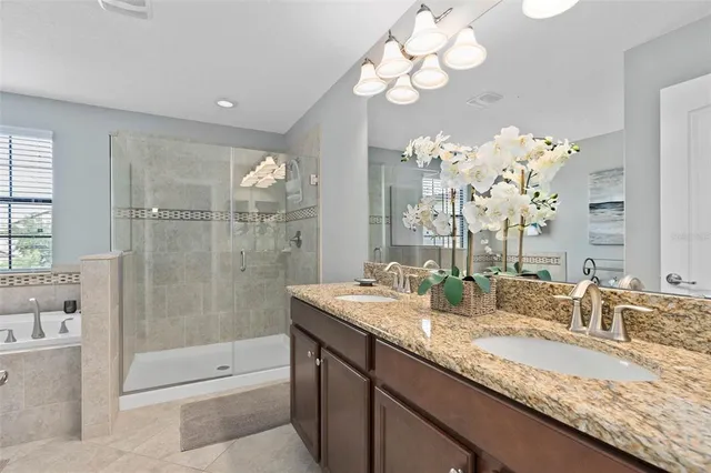 a room with pool table and windows