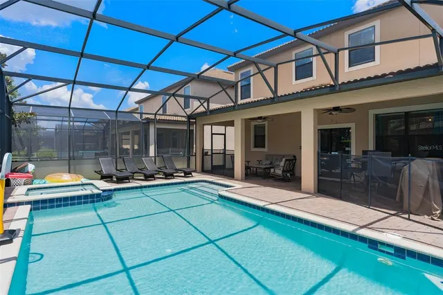 a view of a backyard with sitting area