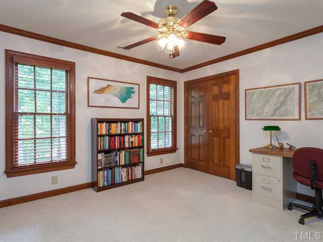 1917 Prescott Place Raleigh, NC 27615 - Photo 19 of 25 The third bedroom is currently used as a home office. Features include plantation blinds, crown molding, a double door closest, and a ceiling fan. Bedroom