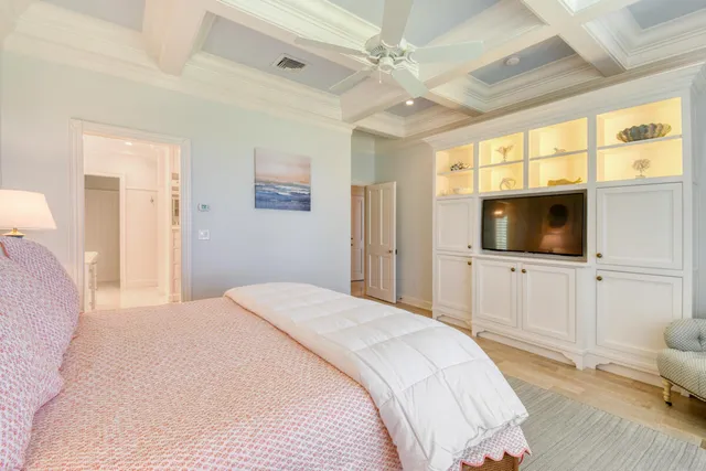 a bed room with a bed and a large window