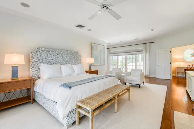 a bedroom with a large bed and a large window