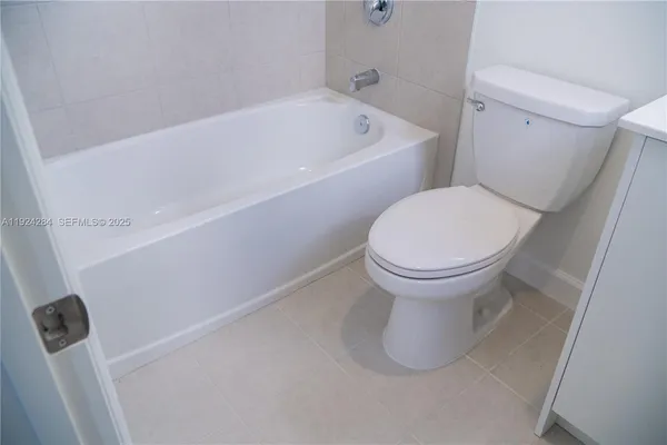 a bathroom with a toilet and a sink