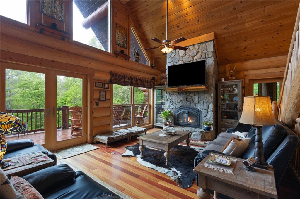 103 Twin Lakes Road Blue Ridge, GA 30513 - Photo 15 of 71 a living room with furniture fireplace and flat screen tv