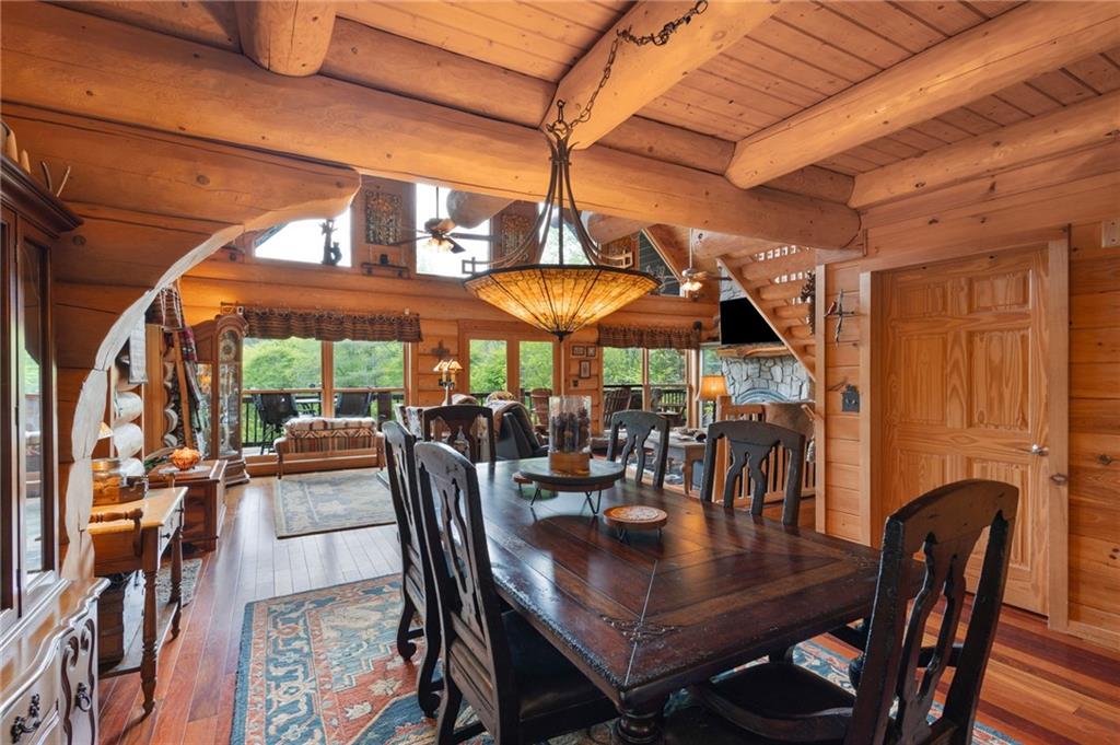 103 Twin Lakes Road Blue Ridge, GA 30513 - Photo 21 of 71 a view of a dining room with furniture and chandelier