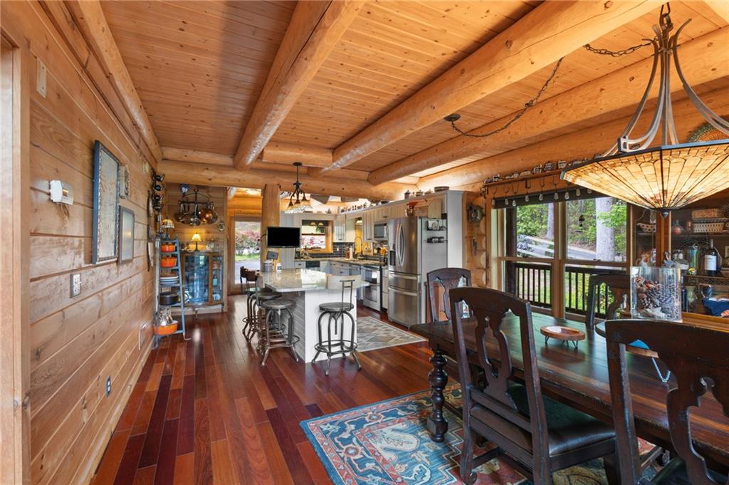 103 Twin Lakes Road Blue Ridge, GA 30513 - Photo 22 of 71 a view of a dining room with furniture window and wooden floor