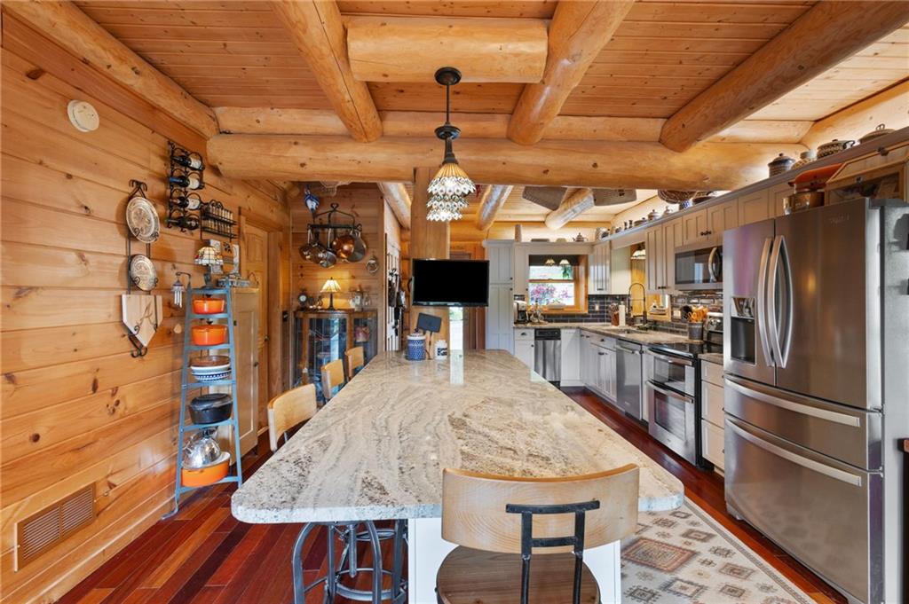 103 Twin Lakes Road Blue Ridge, GA 30513 - Photo 23 of 71 a kitchen with stainless steel appliances granite countertop a sink refrigerator and cabinets
