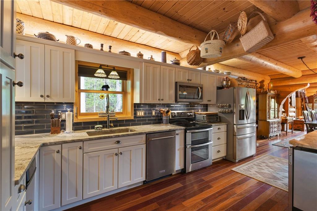 103 Twin Lakes Road Blue Ridge, GA 30513 - Photo 24 of 71 a kitchen with stainless steel appliances granite countertop a stove a sink and a refrigerator