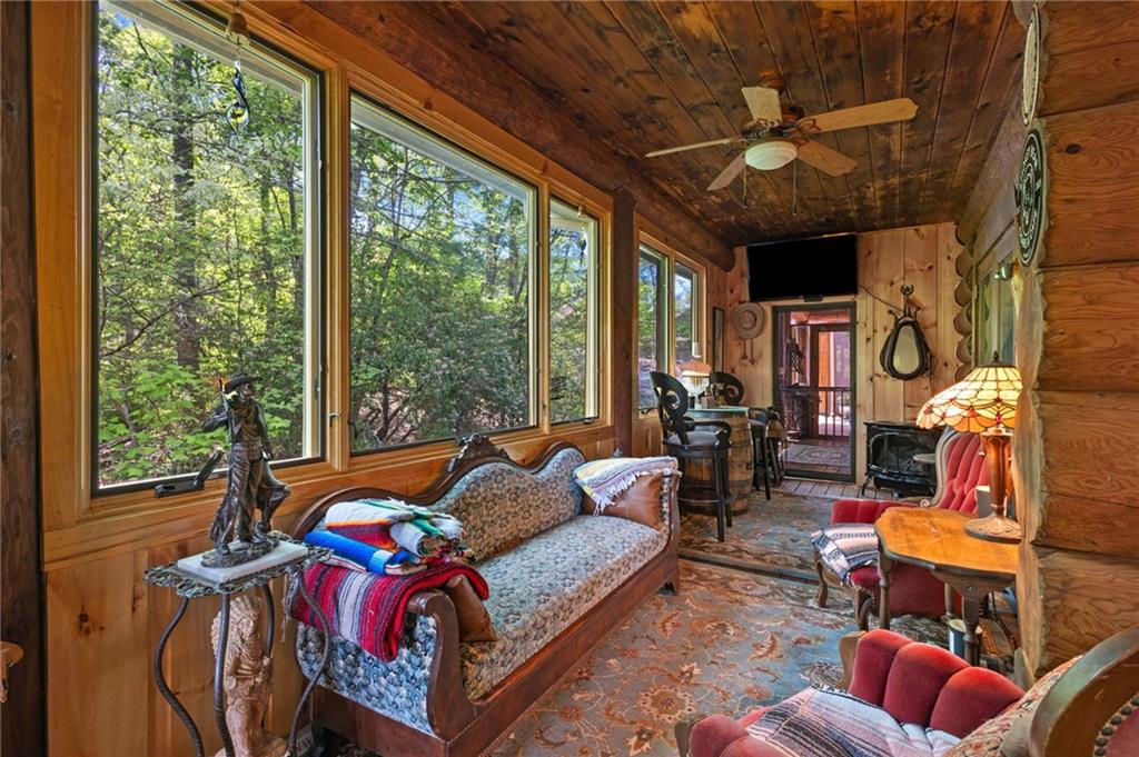 103 Twin Lakes Road Blue Ridge, GA 30513 - Photo 32 of 71 a bedroom with furniture and a large window