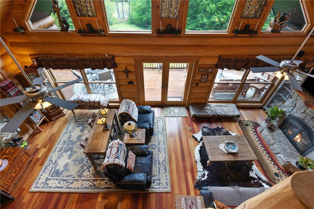 103 Twin Lakes Road Blue Ridge, GA 30513 - Photo 37 of 71 a picture of a living room with a fireplace