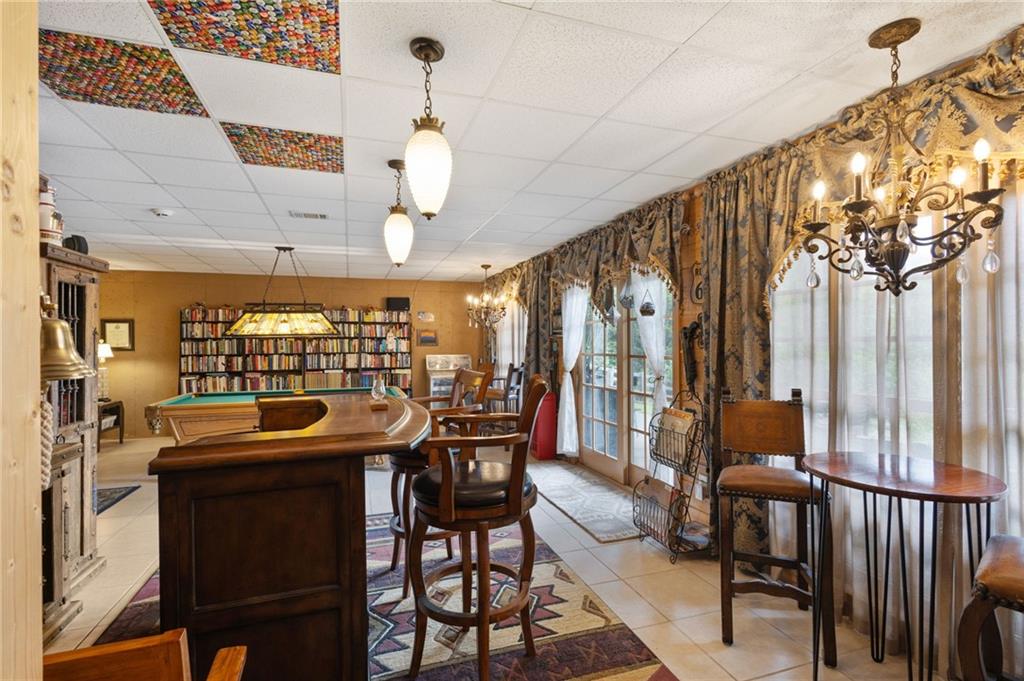 103 Twin Lakes Road Blue Ridge, GA 30513 - Photo 45 of 71 a view of a dining room with furniture window and outdoor kitchen
