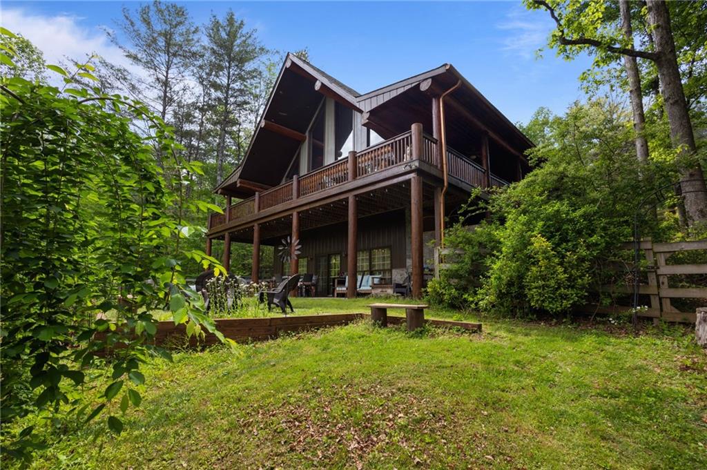 103 Twin Lakes Road Blue Ridge, GA 30513 - Photo 56 of 71 a view of a house with a yard and sitting area