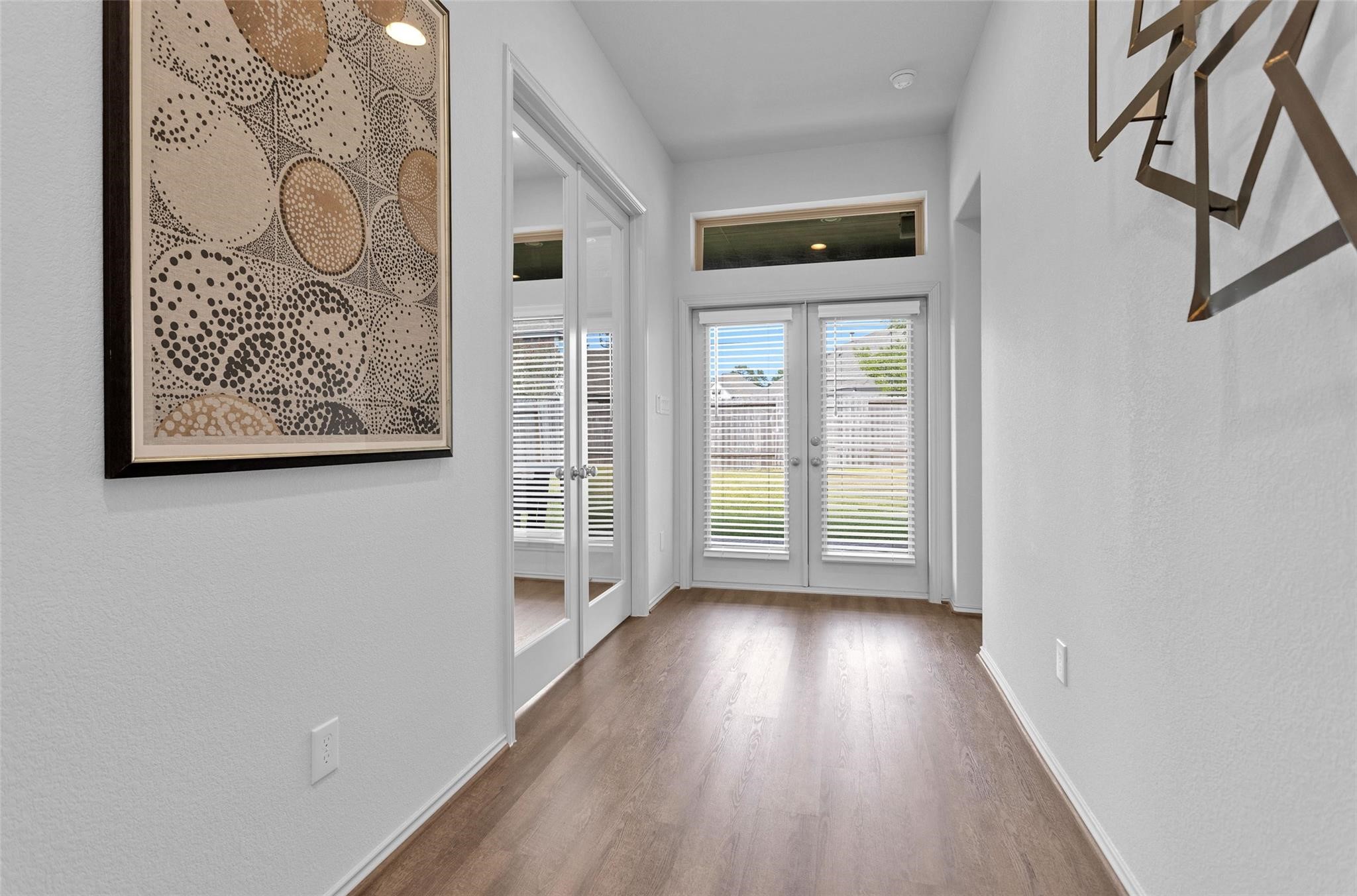 549 Cedar Harbor Court Conroe, TX 77304 - Photo 12 of 25 Hallway leading to study and primary bedroom