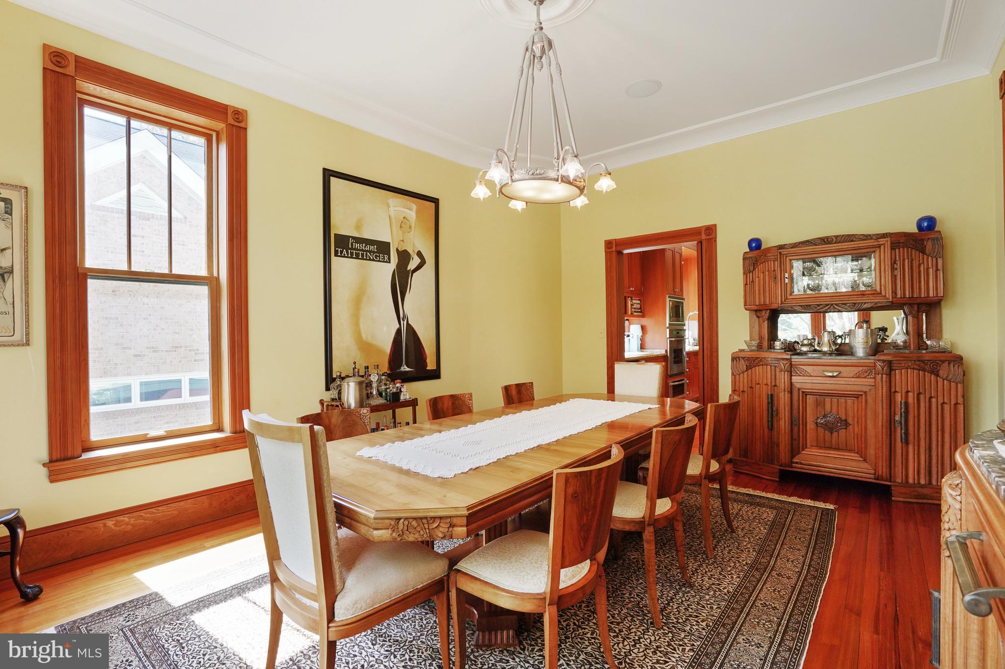 5402 Tuscarawas Road Bethesda, MD 20816 - Photo 14 of 55 a view of a dining room with furniture window and wooden floor