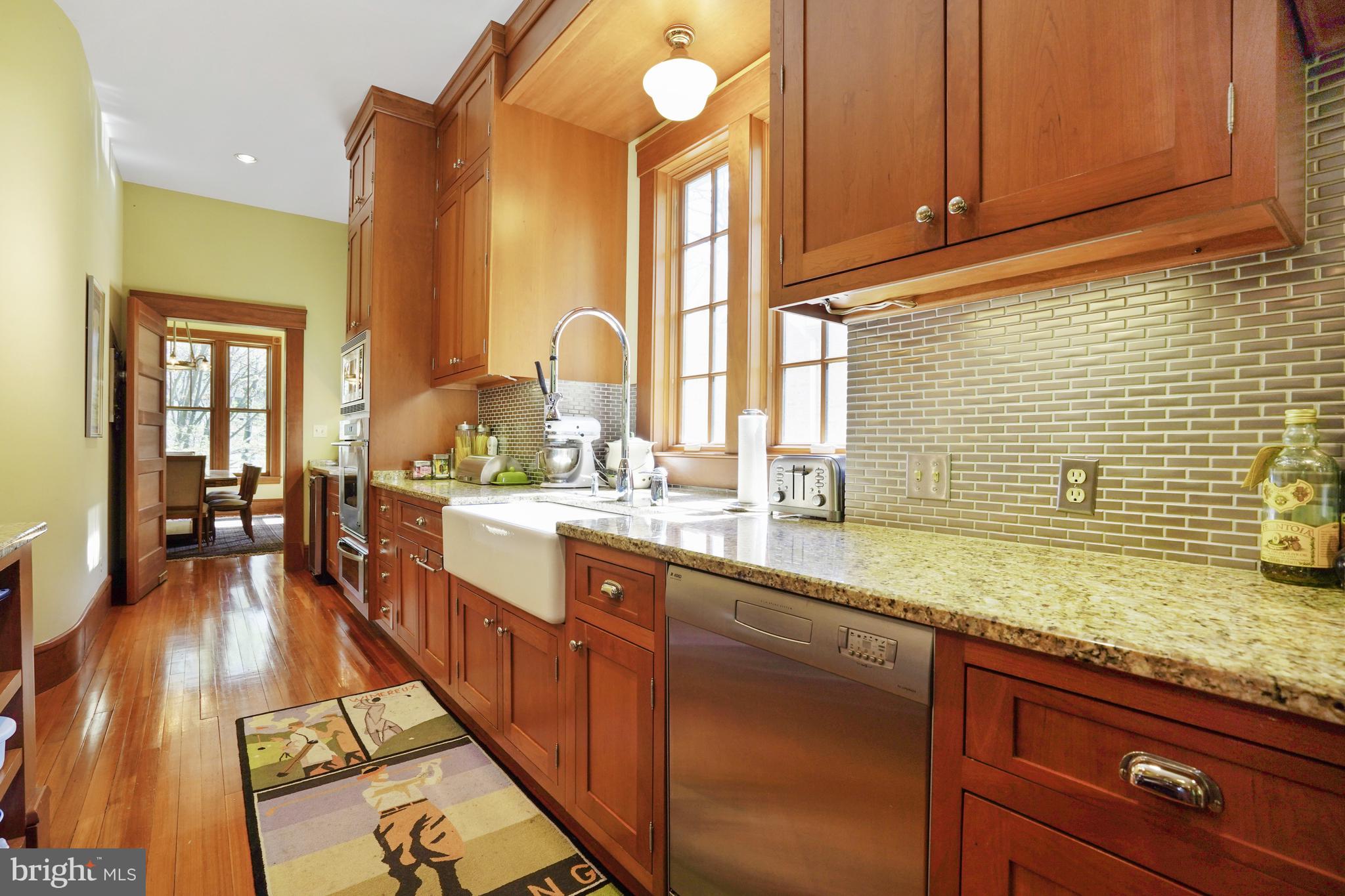 5402 Tuscarawas Road Bethesda, MD 20816 - Photo 17 of 55 a large kitchen with granite countertop a sink and cabinets