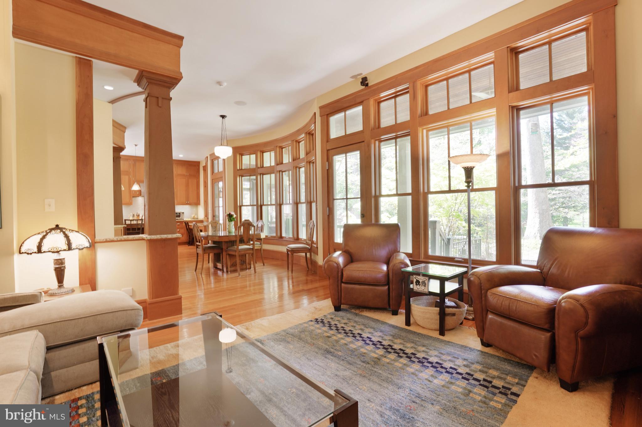 5402 Tuscarawas Road Bethesda, MD 20816 - Photo 20 of 55 a living room with furniture and floor to ceiling windows