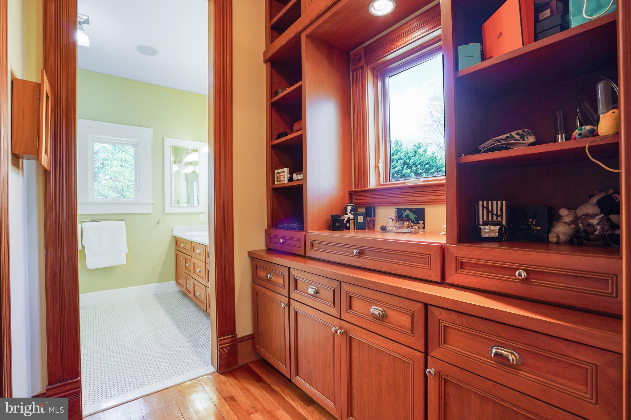 5402 Tuscarawas Road Bethesda, MD 20816 - Photo 26 of 55 a hallway with a large window and dresser