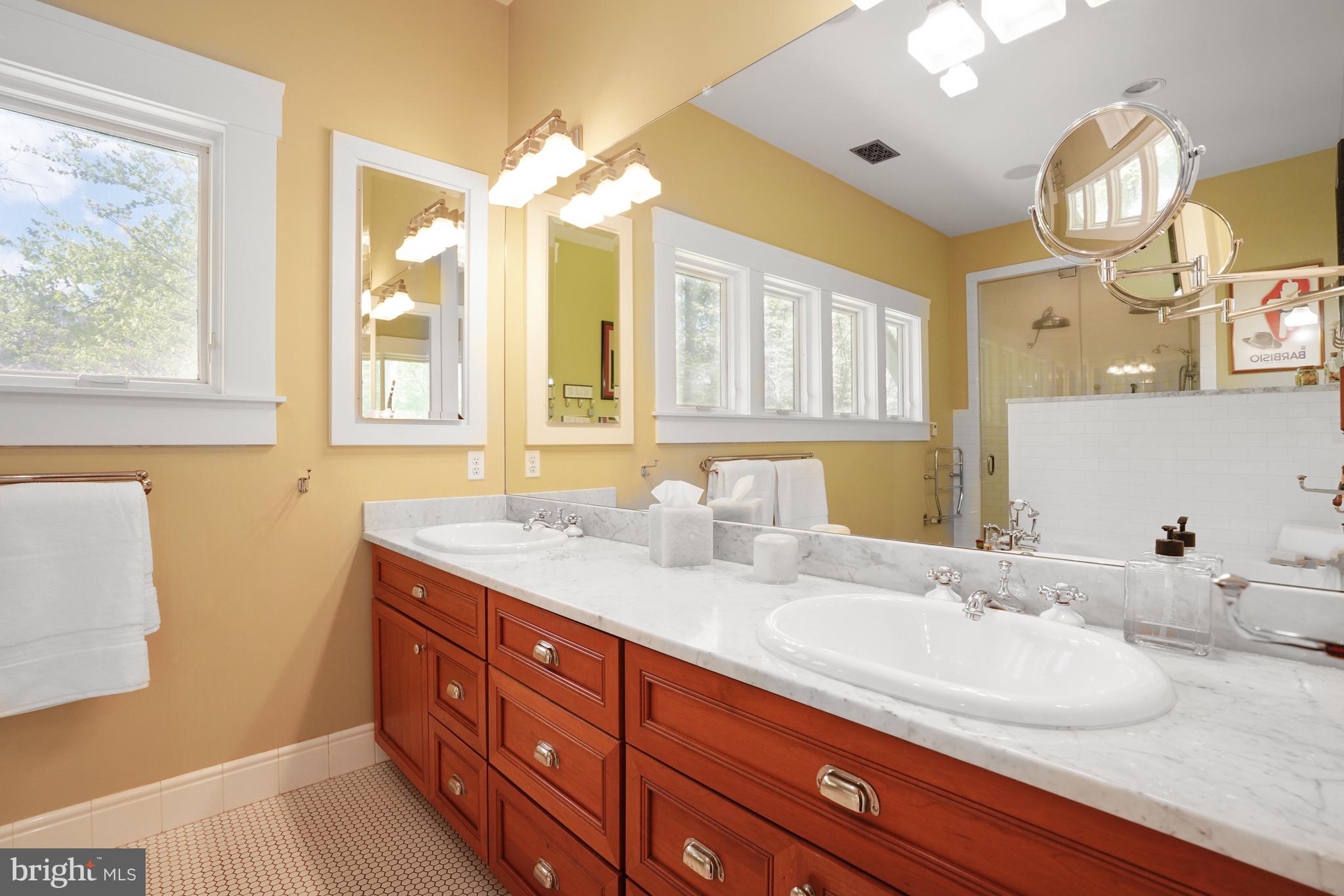 5402 Tuscarawas Road Bethesda, MD 20816 - Photo 27 of 55 a bathroom with a granite countertop sink mirror and double