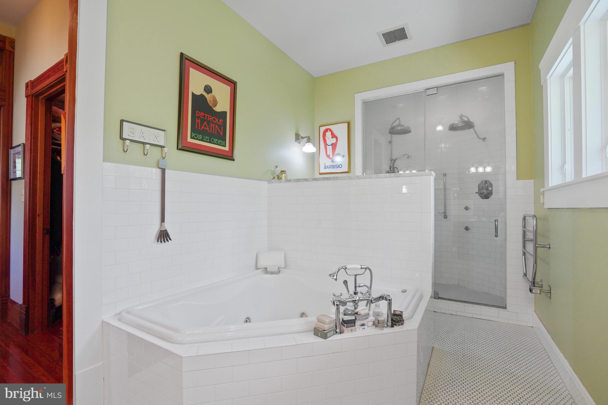 5402 Tuscarawas Road Bethesda, MD 20816 - Photo 28 of 55 a bathroom with a bathtub and a shower