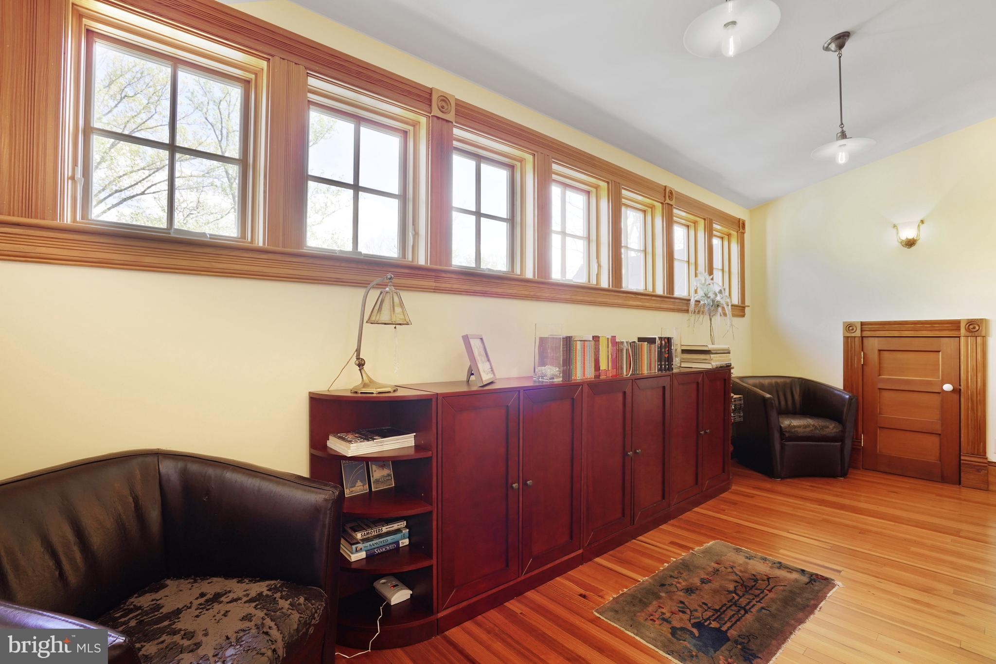 5402 Tuscarawas Road Bethesda, MD 20816 - Photo 40 of 55 a bedroom with a bed and wooden floor