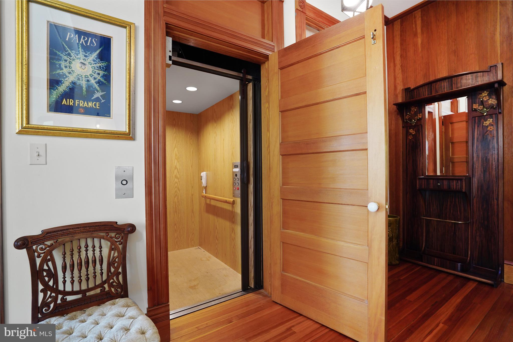5402 Tuscarawas Road Bethesda, MD 20816 - Photo 6 of 55 a view of a hallway with wooden floor and staircase