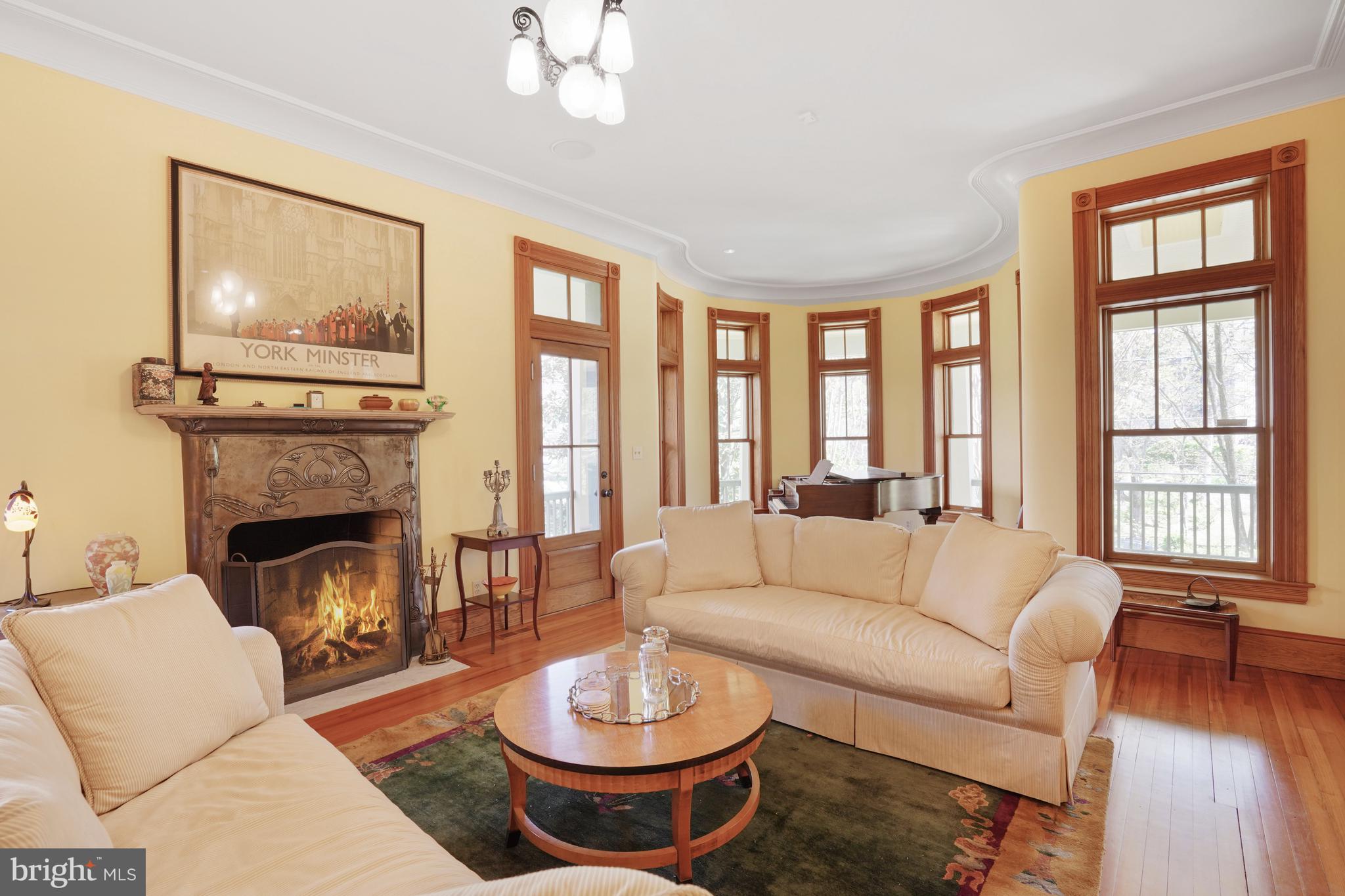 5402 Tuscarawas Road Bethesda, MD 20816 - Photo 10 of 55 a living room with furniture a fireplace and a large window