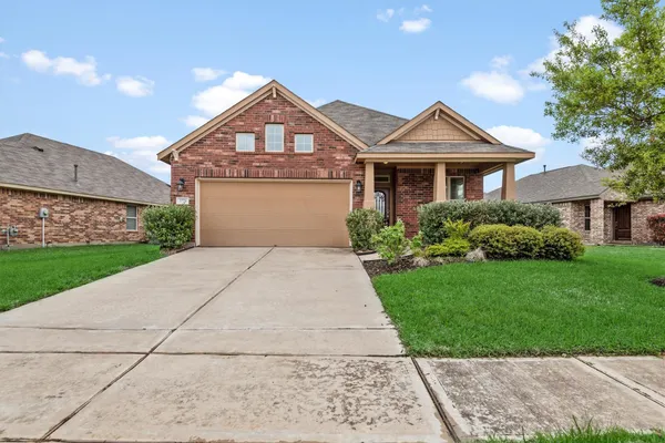a front view of a house with yard