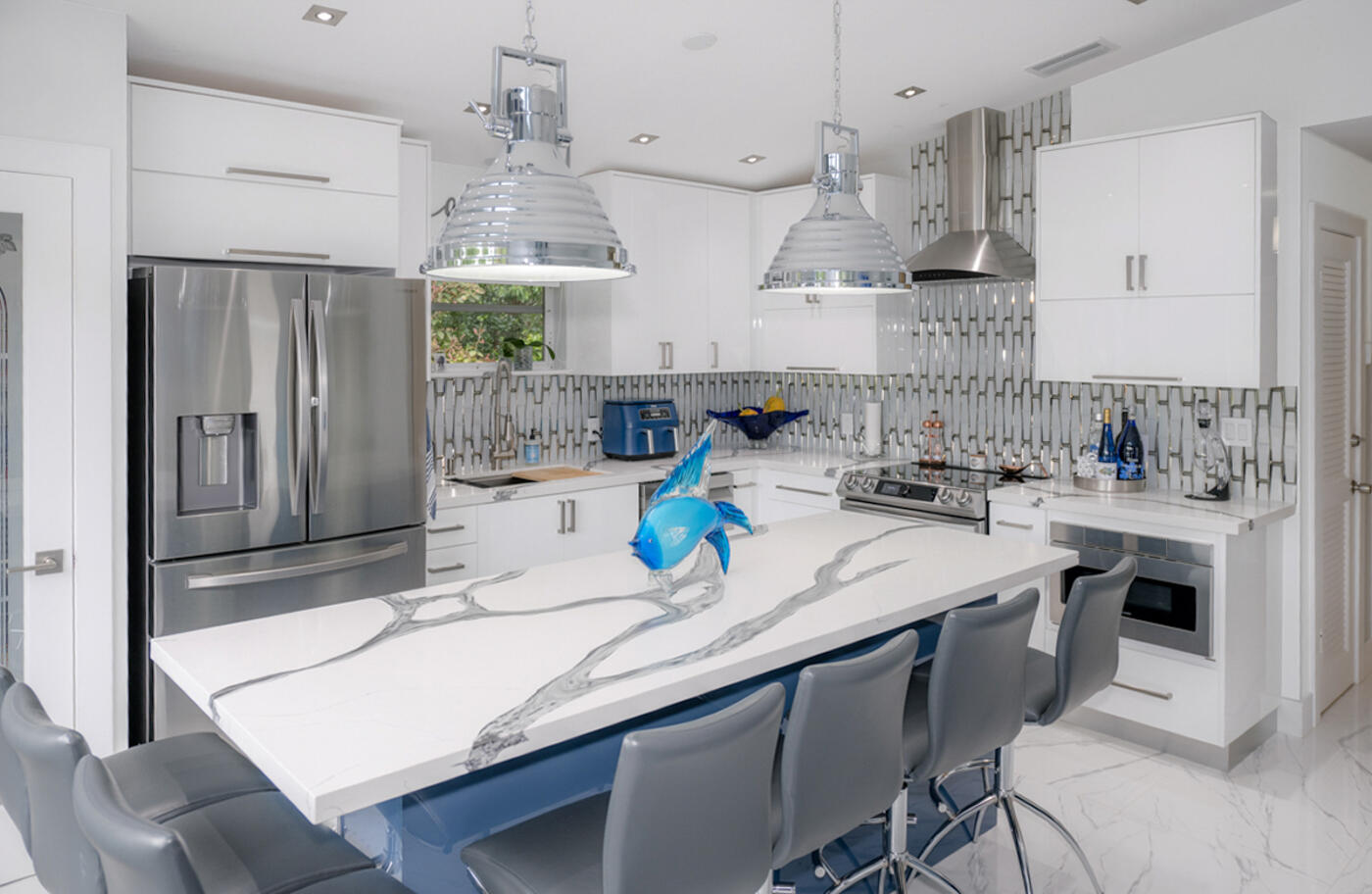 1016 Gibraltar Road Key Largo, FL 33037 - Photo 11 of 39 a kitchen with stainless steel appliances granite countertop a sink window and cabinets