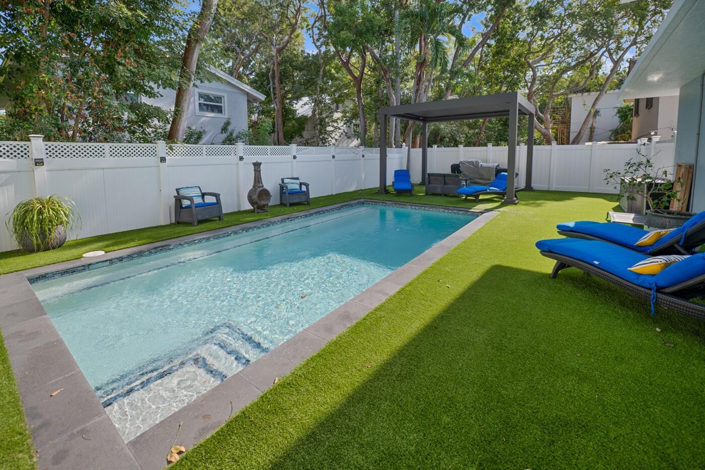 1016 Gibraltar Road Key Largo, FL 33037 - Photo 15 of 39 a front view of a house with garden