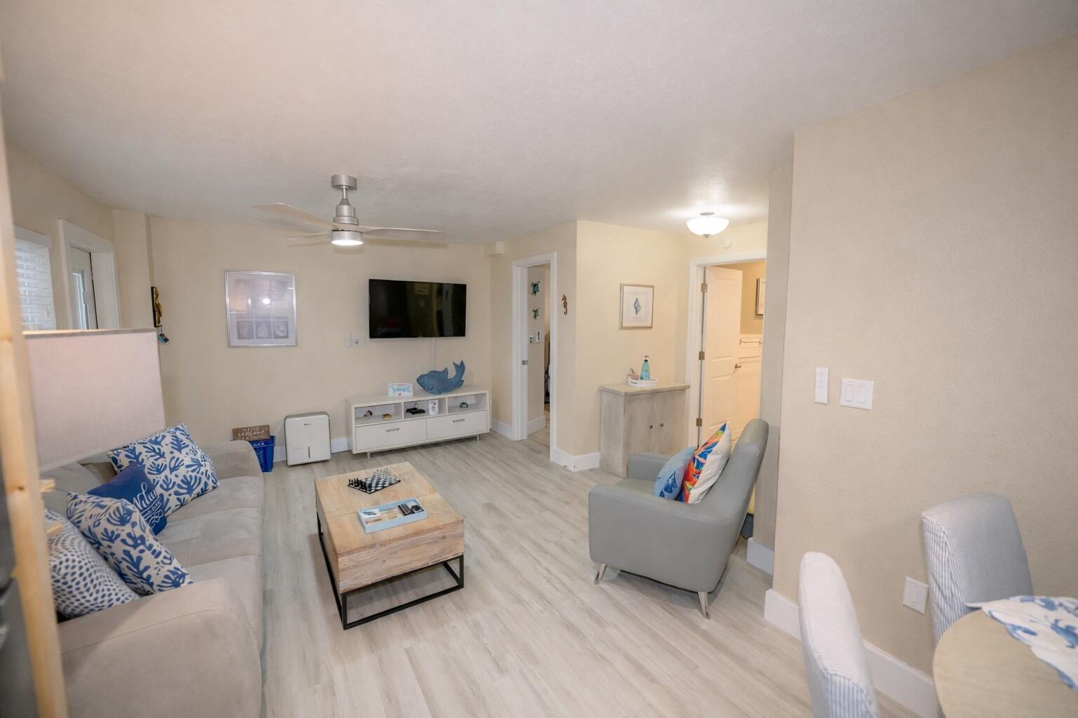 1016 Gibraltar Road Key Largo, FL 33037 - Photo 20 of 39 a living room with furniture and a flat screen tv