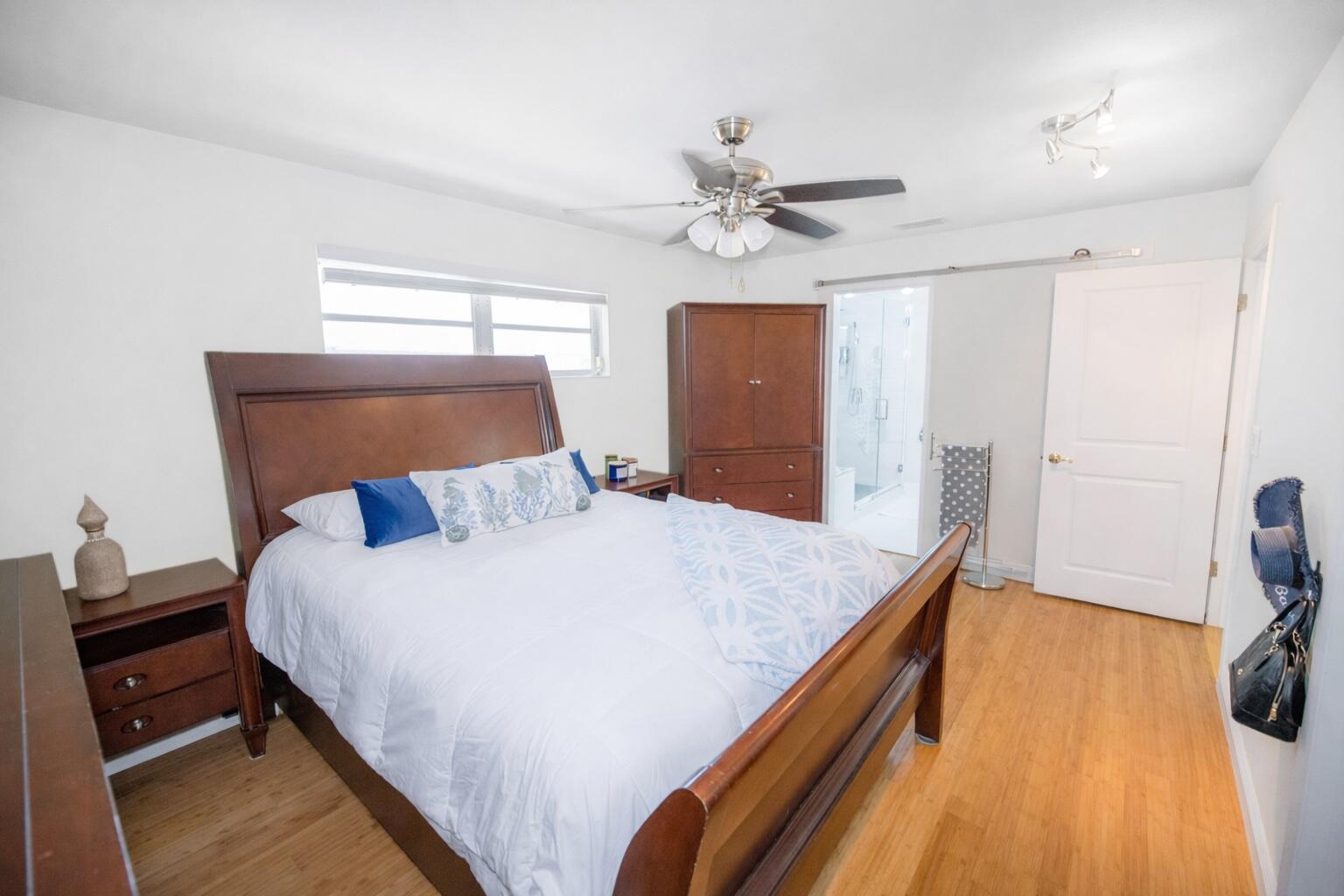 1016 Gibraltar Road Key Largo, FL 33037 - Photo 24 of 39 a bed room with a bed and a chandelier