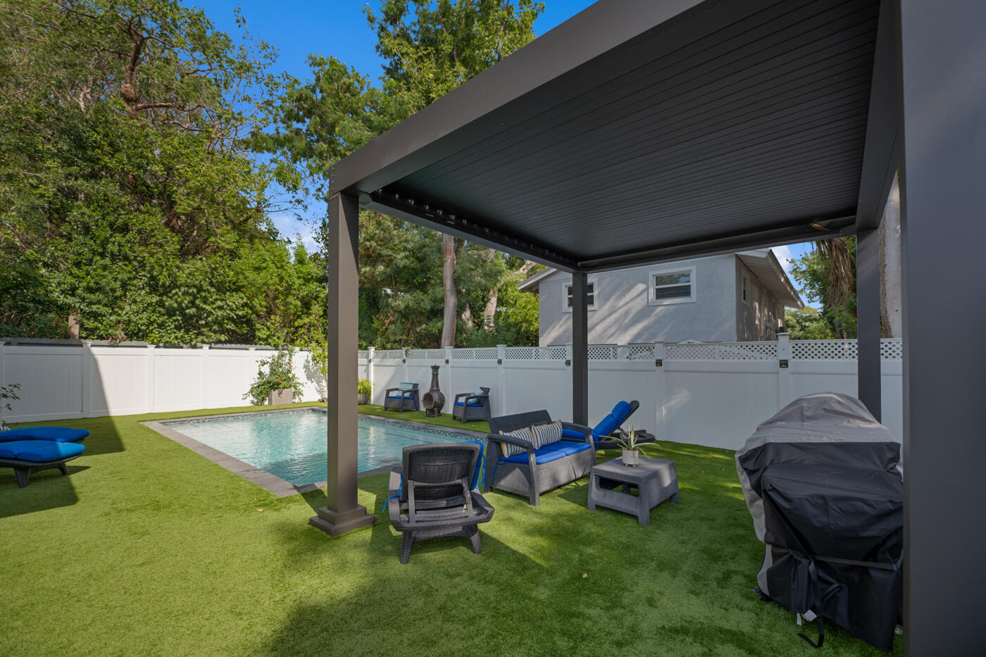 1016 Gibraltar Road Key Largo, FL 33037 - Photo 35 of 39 a view of backyard with a table and chairs
