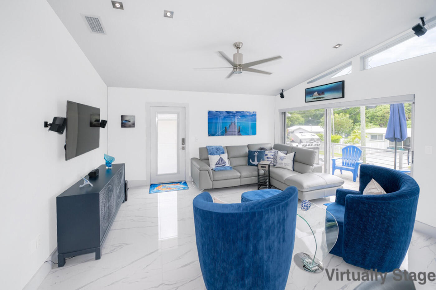 1016 Gibraltar Road Key Largo, FL 33037 - Photo 8 of 39 a living room with furniture and a flat screen tv