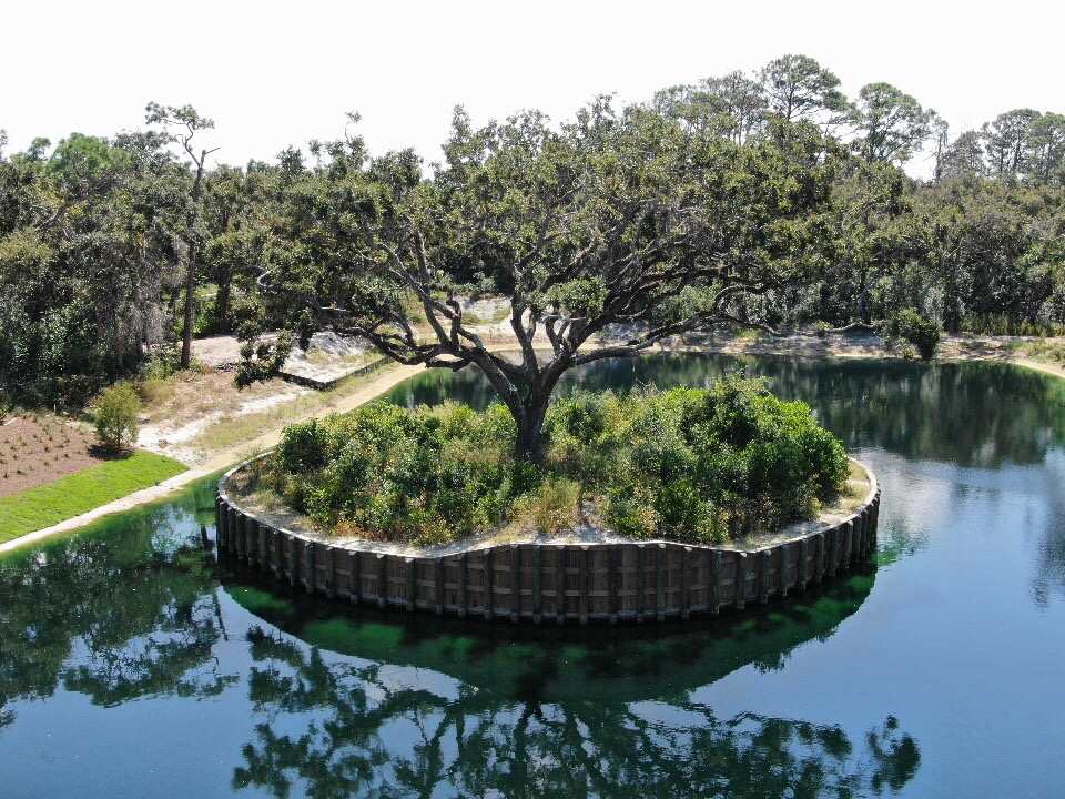 240 Ridgeway Road, Unit LOT 4 St. Augustine Beach, FL 32080 - Photo 6 of 8 a view of a wooden deck with a lake view