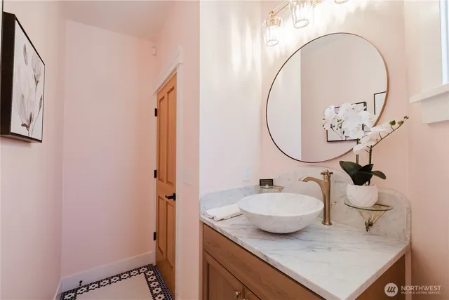 a bathroom with a sink and a mirror