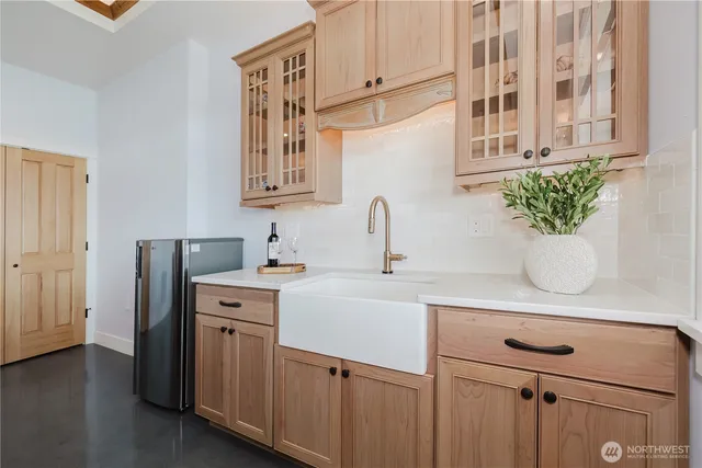 a kitchen with a sink and cabinets