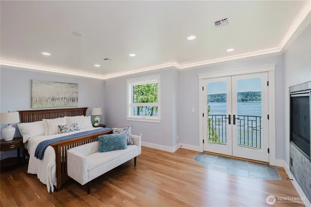 a bedroom with a large bed and a window