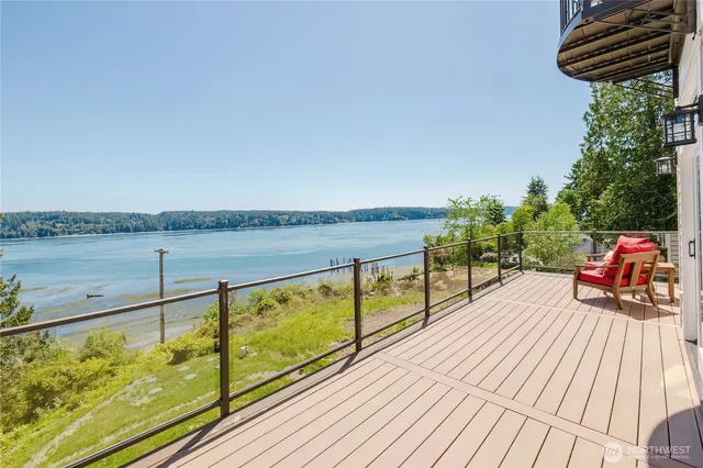 a view of a balcony with wooden floor