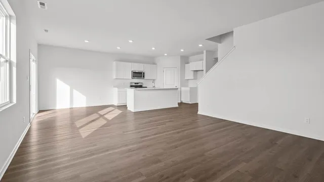 a view of kitchen with wooden floor