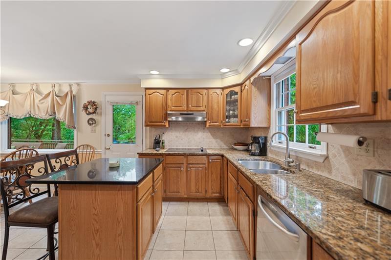 4914 Simmons Circle Export, PA 15632 - Photo 11 of 33 a kitchen with stainless steel appliances granite countertop a sink stove and cabinets