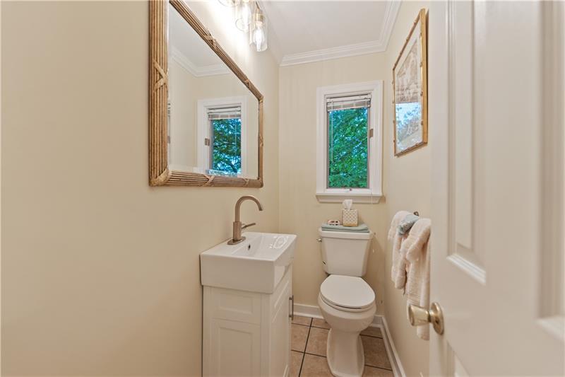 4914 Simmons Circle Export, PA 15632 - Photo 17 of 33 a bathroom with a toilet sink a mirror and a window